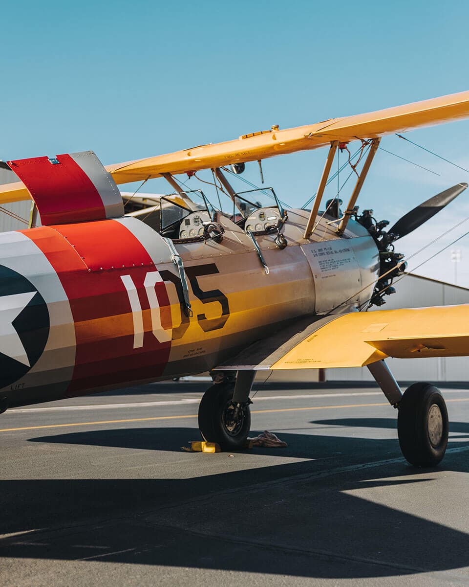 Side-shot of a biplane on the ground